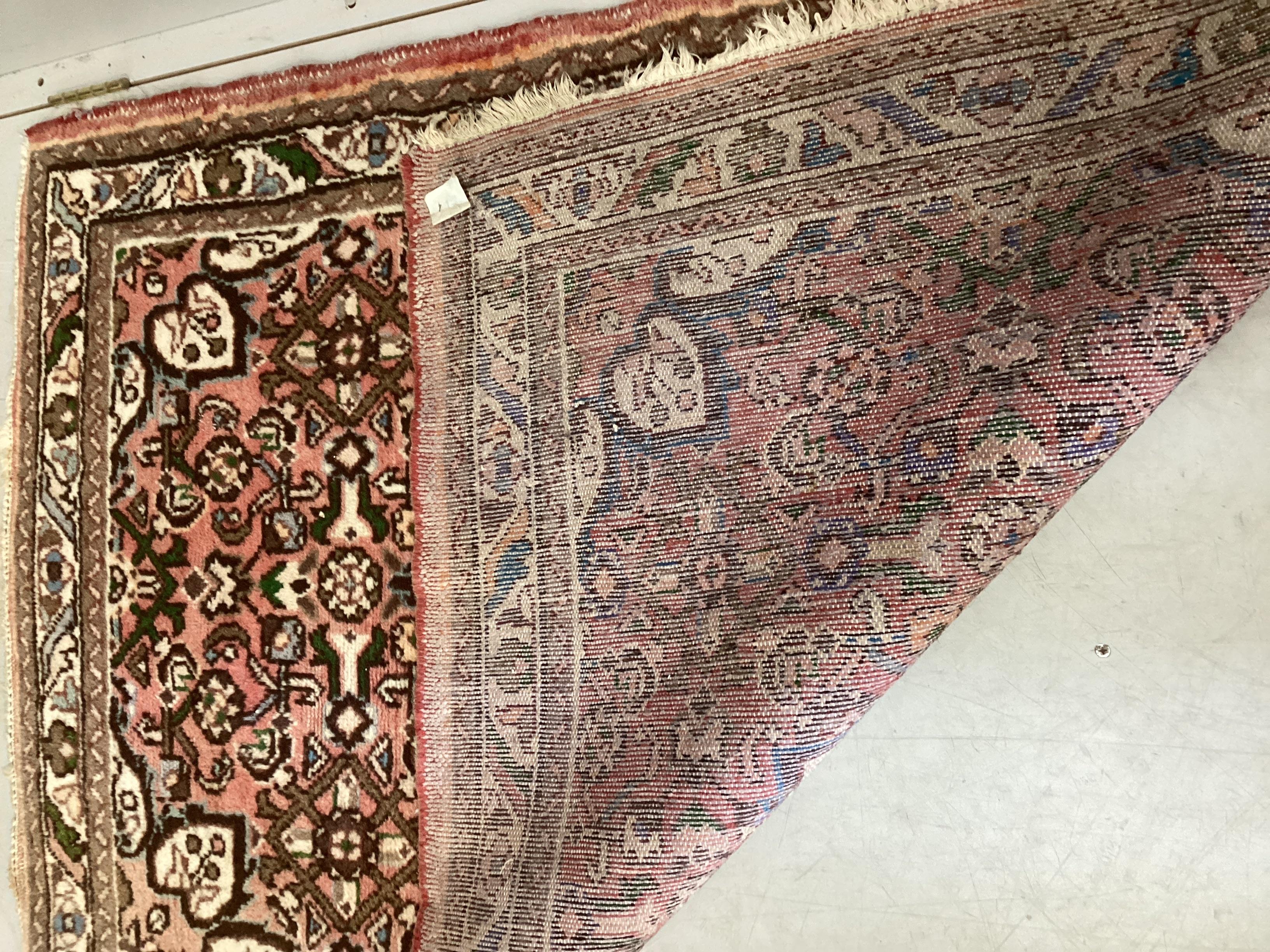 A North West Persian peach ground rug, 148 x 100cm